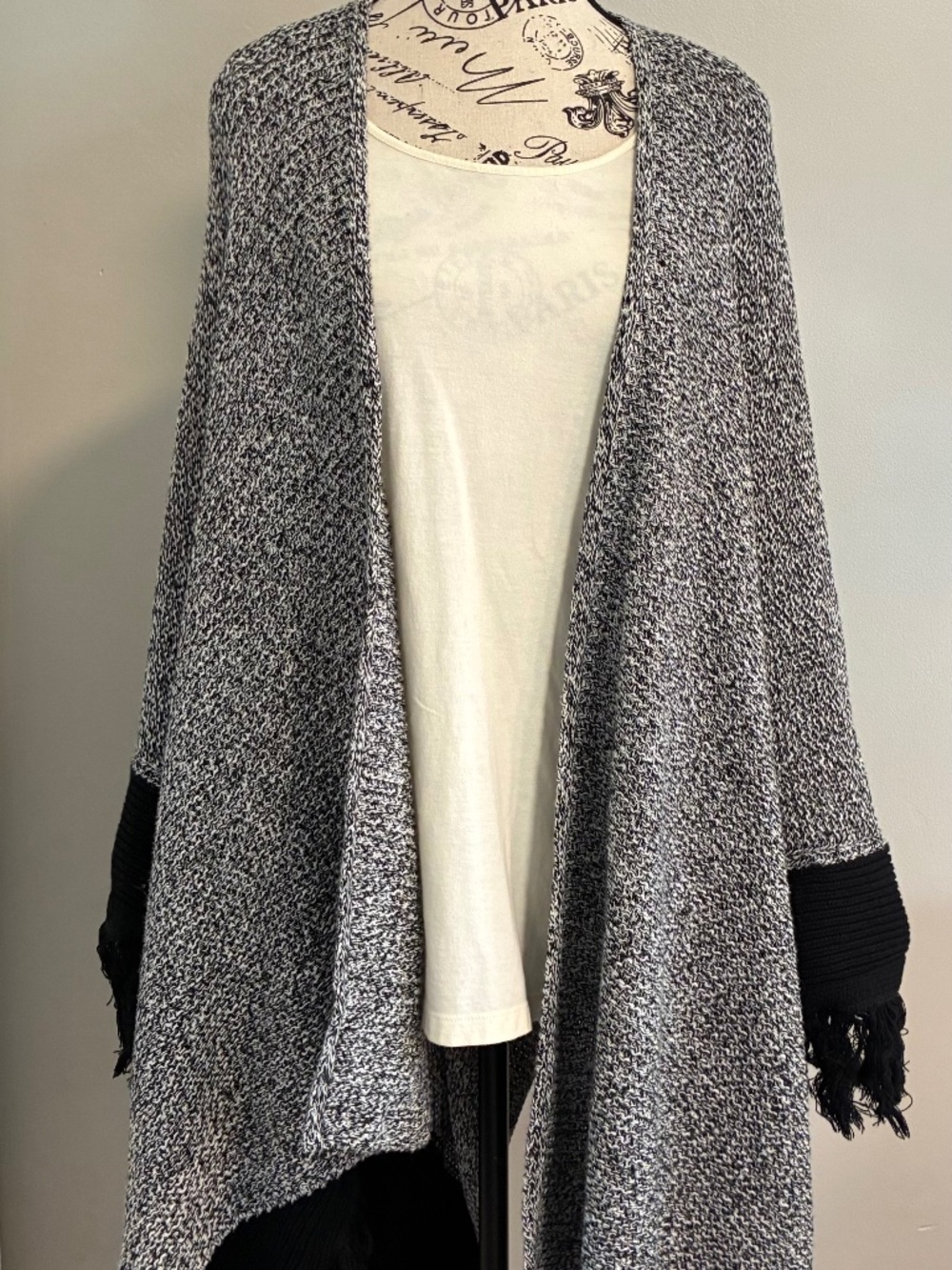 Cabi pepper cape fringe shawl, black & white speckled knit wrap. Stylish comfort